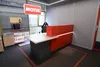 Ресепшн Баухаус в фирменном красном цвете Motul с логотипом — реализованный проект.